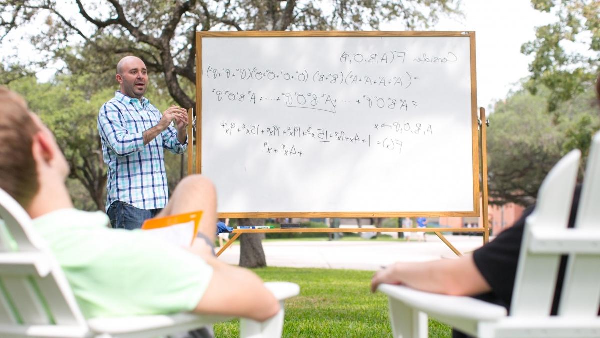 Professor Teaching Students Outdoors