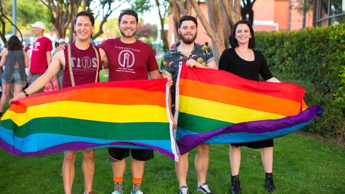 Group of students with a gay pride flag