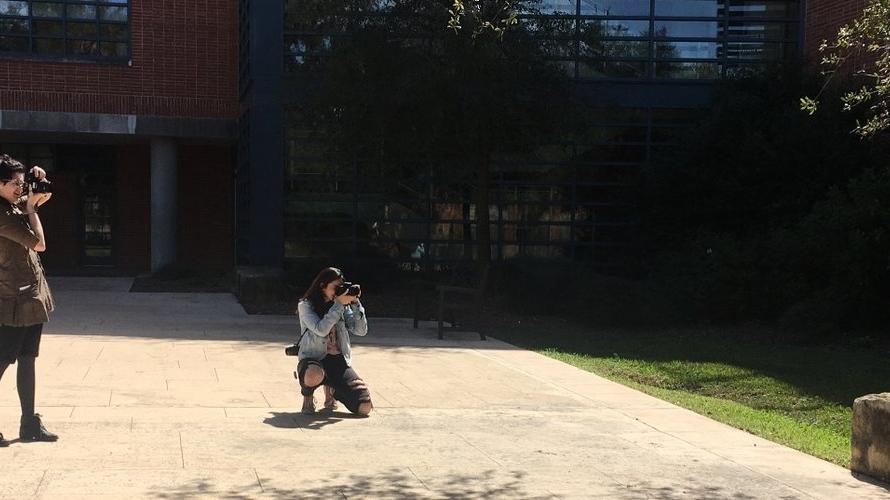 Students take photos around the Trinity campus