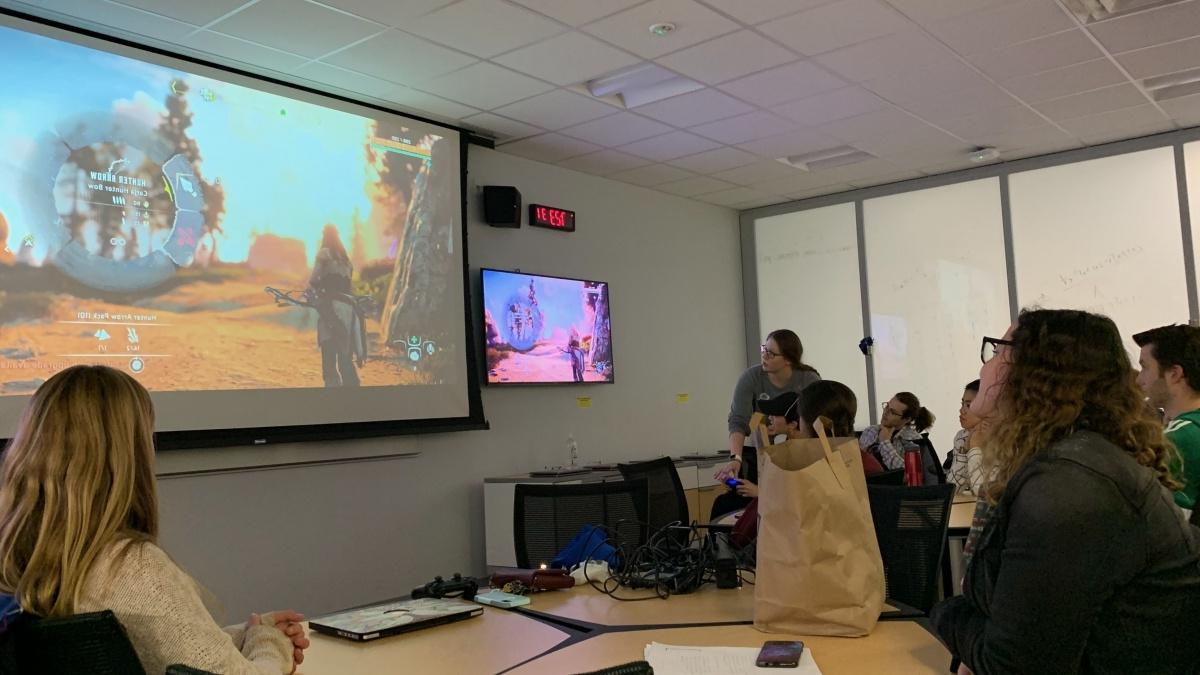 Students evaluate a video game in class